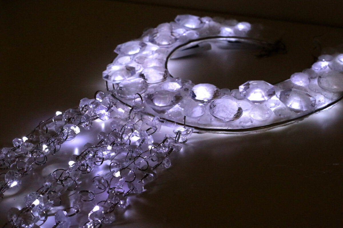 Opera singer wearing LED accessories